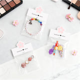 joycraft Jewelry Packaging for Small Business – 100Pcs White Bracelet Display Cards with Clear Bags, Small Handmade Jewelry Display Set for Bracelets, Key Chains, Earring, DIY Craft (Pink Flower)